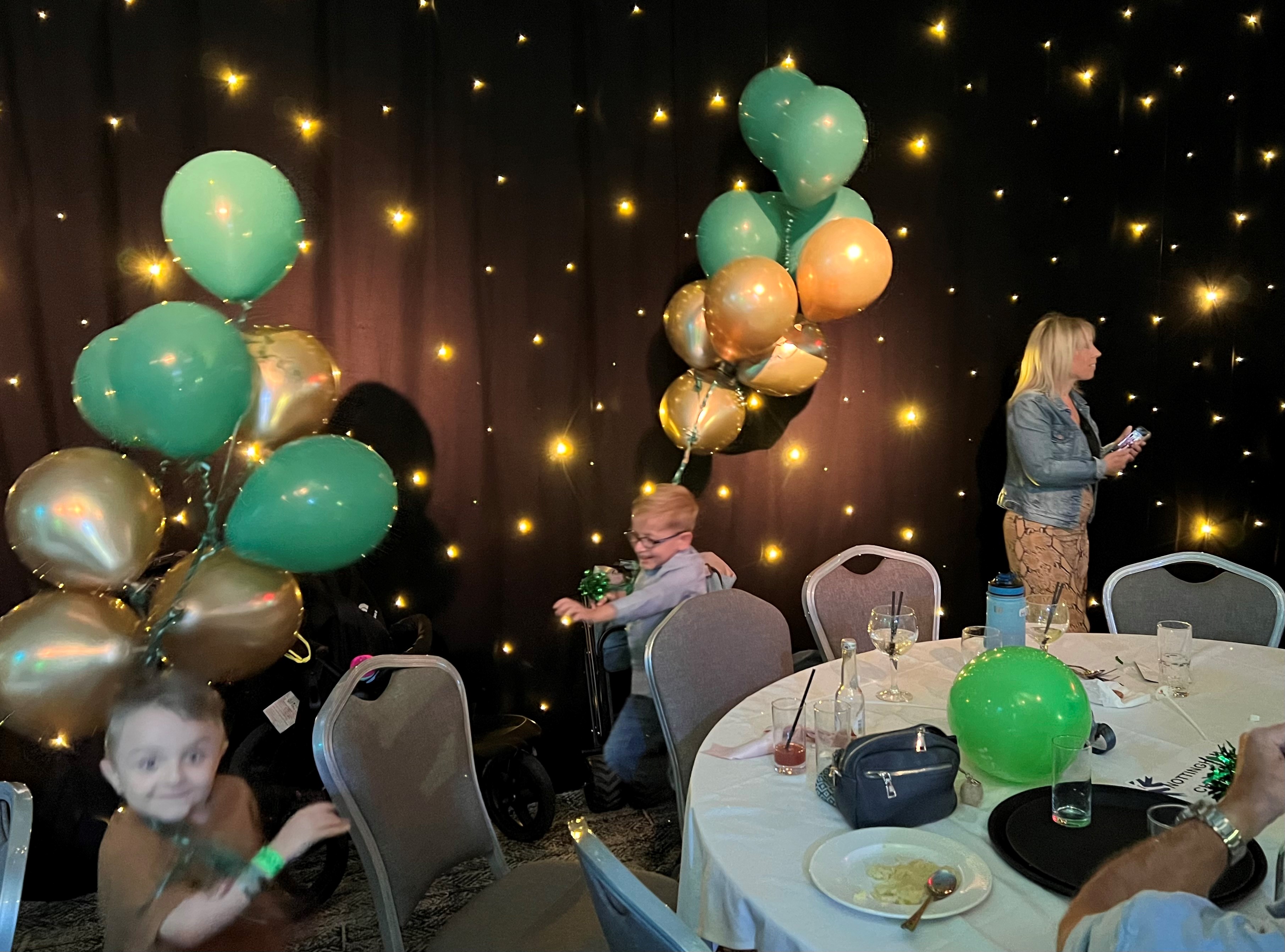 H and W balloon chasing at celebration party